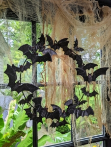 On the window, we hung this fun 18" Glittered Metal Bat Wreath - just right to welcome all your guests on All Hallows' Eve.