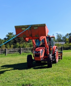The tractor is used to pull the shed into its new position.