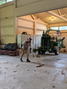 And here's Moises sweeping all the debris on the floors - soil, leaves, dust, etc. These rugged cement floors are then washed and blown dry.
