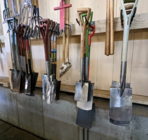 All the garden tools are hung on sturdy hooks. It is so important that each tool is wiped down thoroughly after every use. These hooks store our spades in all sizes for different jobs.