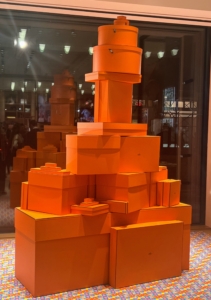 In the window of the new Hermès flagship, one could see dozens of the iconic orange-hued boxes.
