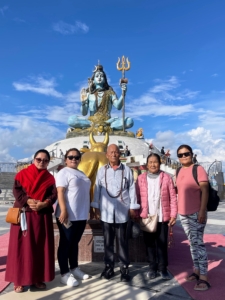 Here, Dolma, her sisters, and her parents stand in front of the Lord Shiva Statue Pumdikot - one of the major attractions in Pokhara. This is Nepal’s tallest Lord Shiva Statue and was built in Mathura, India and then brought to Nepal.