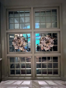 Here are the wreaths hung on the windows. I love hanging wreaths on the windows of my home where guests can see them from the inside and the outside.