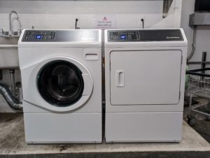 Here is our new Speed Queen washer on the left, and a matching dryer on the right. Another good tip when purchasing a new washing unit is to make sure the doors are hinged on the most convenient sides. Our washer opens out to the left while the dryer swings open to the right. Doors are not in the way when unloading and loading.