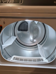 This dryer has a large drum capacity for a large load of towels or horse blankets. The dryer also includes a Pet Plus feature for removing hair as well as anti-static capabilities. To prevent the dryer from overheating, always clean the screen or filter after every use, and remove accumulated lint from behind the dryer.