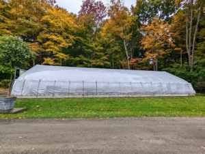 The finished hoop house is now ready for storing my tropical plants. This greenhouse works by heating and circulating air to create an artificial tropical environment. It includes three fans and a propane fueled heater. It is an excellent way to ensure my warm weather specimens survive the cold winters of the Northeast. Wait until you see how many plants we can fit in here - you'll be amazed. Stay tuned.
