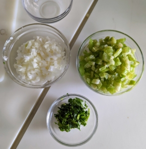This is called "mis en place" - a French culinary phrase meaning "putting in place" or "gather". It refers to the setup required before cooking, and is often used in professional kitchens to mean organizing and arranging the ingredients.