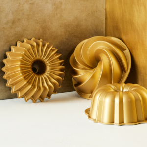 These are Nordic Ware's Brilliance bundt pans. They are constructed of durable cast aluminum with a nonstick coating and a display-ready gold finish. It's a baker's must-have for perfectly formed cakes. Plus, they're so easy to clean.