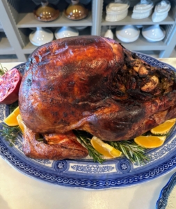 My Perfect Roast Turkey 101 recipe, which is found on Martha.com, really creates a well bronzed and glistening bird. This turkey was stuffed with brioche bread, white bread, apples, and vegetables cooked in broth. The turkey is plated on a bed of herbs grown right here in my garden, with citrus and pomegranate slices.