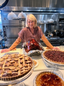 Here I am on Thanksgiving Day with our perfectly roasted turkey and some of the pies I made the day before - all displayed for my guests to see when they arrive.