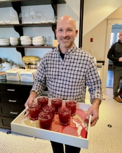 This is Jane's husband, Mike Sweeney, holding the tray of cocktails.
