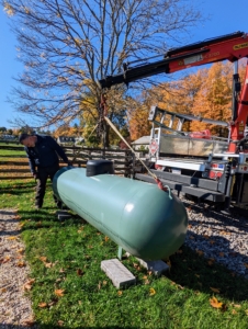 Meanwhile, the propane tank that will fuel the heater is installed. These hoop houses are temperature and humidity controlled. They work by heating and circulating air to create an artificial tropical environment.