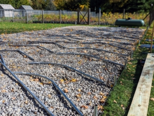 The pipes are laid out on the gravel, so the team can assemble them properly and efficiently.