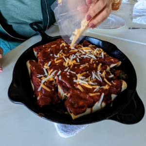 Once a little browned, she removes the skillet from the oven, tops it with more sauce and the remaining cheese and then bakes it again until the cheese is melted - about two to three minutes.