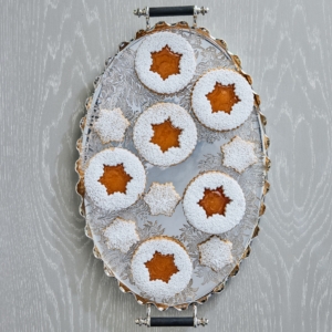 These are my Hazelnut Snowflake Linzer Cookies filled with fruity centers and dusted with confectioners' sugar - another popular holiday cookie recipe in Martha: Harvest + Holiday 2022.