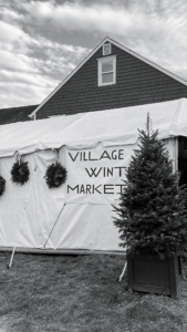 This outdoor tent also housed additional vendors and was decorated with holiday wreaths and trees.