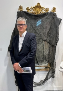 This is Jay Jopling, an English art dealer, gallerist, and the founder of the gallery, White Cube. Here he is standing in front of a really interesting and exquisite work of art - Untitled by David Hammons, 2014. It's a Federal mirror covered in scrim. Reminds me of all the Federal mirrors I have in my home, except mine are never covered with anything.