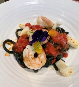 This bucatini pasta is served with shrimp, cuttlefish, tomato, parsley, and guanciale.