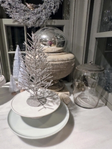 In my servery, just off my kitchen - more sparkling silver trees placed on white cake stands.