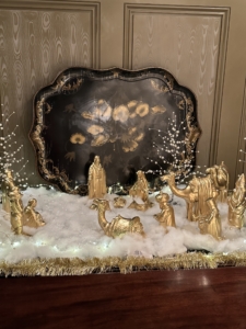 My 14-piece Nativity Set is now available in gold from Martha.com. We placed all the figures on the table under a bed of soft, snowy cotton and lights.