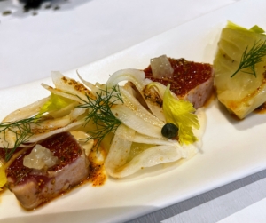This is a duo of yellowfin tuna with fennel pollen, socca crisp, and tonnato sauce, an Italian tuna sauce.