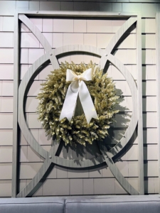Guests are greeted with shimmering wreaths of champagne gold adorned with big white satin ribbons. My LED Pre-Lit Champagne Tinsel Wreath is 30-inches wide with individual sprigs of greenery intertwined with gold tinsel and lights.