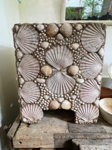 This is a vintage French concrete planter with encrusted seashells.