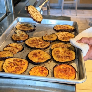 This photo shows the top side of the eggplant done. Once one side is cooked, they are flipped drizzled with oil and broiled again for another five to 10-minutes.