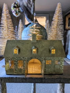 Last year, I created artful metallic houses modeled after the outbuildings here at my farm. This one is my stable with its big doors in front. Lights shine through all the windows of these gold-toned structures. They’re great on a table or along a wide windowsill where guests can see them.