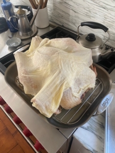Christian and Elizabeth used my Turkey 101 recipe for the first time and say they will now make it a tradition. Here's the bird dressed with cheesecloth ready for the oven.