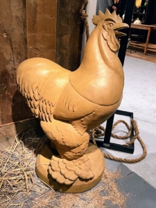 This piece was included in a design co-chair vignette by Bunny Williams and Elizabeth Lawrence of Bunny Williams Interior Design. It is by Wheeler Williams (1897–1972) and is one of a pair of Gatepost Roosters, 1932. It's made from Terra cotta and is 34 inches high. It is also signed and dated by Wheeler Williams, 1932.