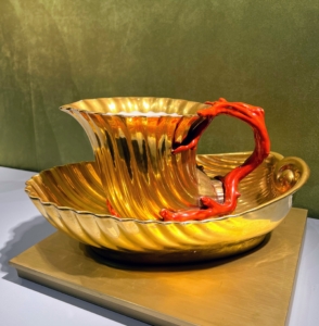 This piece is a Gold Ground Shell Ewer and Basin from Dagoty Porcelain Manufactory (France 1798-1820), Circa 1810-15 The Exhibitor: Michele Beiny.