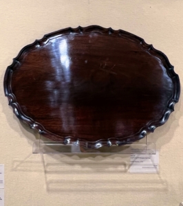 And here is a George III Mahogany Oval Tray London, England, c. 1770 Exhibitor: Michael Pashby Antiques. Mahogany is a straight-grained, dark reddish-brown timber.