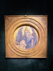 This is a Charlotte Major Wylie (London 1828 – 1909 Aberystwith, Wales) piece called The Veiled King Death. It is made of tempera and gesso, with silver and gold leaf, bone, pearl, agate and colored stone inlays, on a circular wood panel, set within a richly ornamented frame designed and fabricated by the artist. This piece is part of a special curated exhibition for The Winter Show by exhibitor Robert Simon Fine Art titled “Heroines of the Brush: Women Artists from the Renaissance to the 20th Century." The Exhibitor: Robert Simon Fine Art.