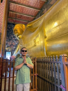 Here's Chhiring inside The Grand Palace paying his respects to the giant Thai kings and statues.