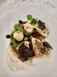 This dish includes Day Boat John Dory “Goujonettes”, black truffled “dashi”, parsley root, and braised Brussels sprouts.