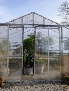 Here at the farm, I now have six different greenhouses. This is the newest - located in front of my vegetable garden right off the carriage road and across from another tropical hoop house. These hoop houses work by heating and circulating air to create an artificial tropical environment. The entire structure is built using heavy gauge American made, triple-galvanized steel tubing.