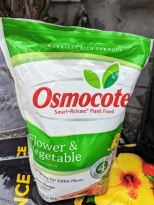 We use Osmocote – small, round coated prills filled with nutrients.