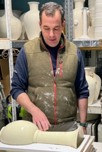 Here is Christopher explaining the manufacturing process to me. Each piece is hand thrown and then molded, glazed, and wired. Christopher is always developing new glazing techniques, new colors, and patterns.