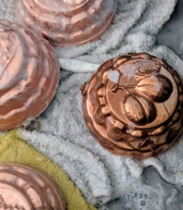 These molds show the difference between freshly polished and non-polished pieces. Notice the ones on the left are in the final soap and rinse stage - so shiny, while the darker piece on the right is waiting its turn.