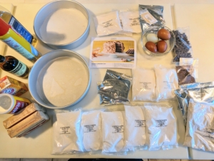 Each baking kit includes the dry ingredients and recipe for the selected sweet treat. These are the ingredients for the Chocolate Celebration Cake.