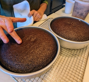 The cakes are done. They are ready when a finger lightly pressed in the center springs back and leaves only a light impression.