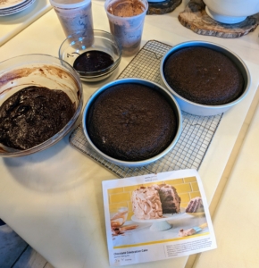The cakes will cool and then everything will be assembled. The cakes are halved, and then spread with pudding between each layer and then frosted. This cake is definitely for chocolate lovers.