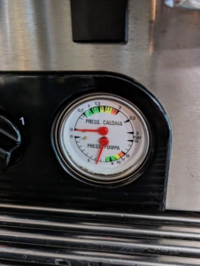 This is the pressure gage. The top indicates the pressure of the steam, while the bottom displays the pressure of the water. When it is in use, both areas should always be within the green limits.