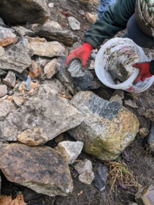 Smaller stones are collected from the pile and used - nothing is wasted. And the tighter the fit is, the stronger the wall. Most stone walls were built without mortar, using gravity and the shape of the stones to hold them together.