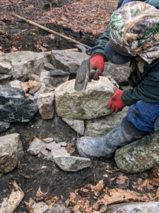 Some pieces need to be chiseled to fit tight crevices. These masons knew exactly how much stone to chisel in order to create the pieces they need.