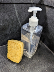 First, Carlos cleans everything with regular dish soap and a soft sponge. I like using an unscented non-abrasive dish soap, but if needed, one can use a harder scouring soap to remove any stuck on food - it won't hurt the stone.