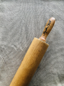 Andrew purchased this rolling pin from the tag sale and asked me to sign it for him.