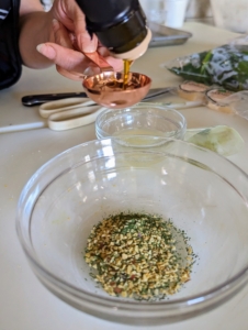 In he bowl, Elvira combines the spice blend along with three tablespoons of olive oil and a tablespoon of the lemon juice.