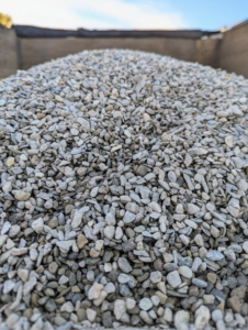 Next, is the gravel. I chose quarter-inch native washed stone. Each stone is about the size of a pea. This same gravel stone is also used to line the paths in my flower cutting garden. It s nice to keep everything uniform when possible.